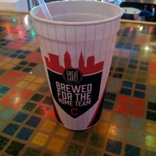 a cup of beer on a table