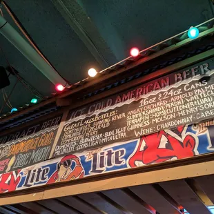a menu on the wall of a bar