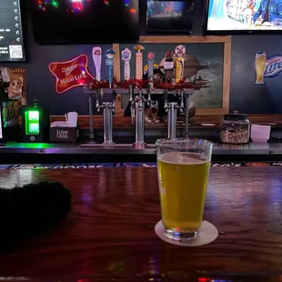 a pint of beer on the bar