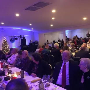 a large group of people sitting at tables