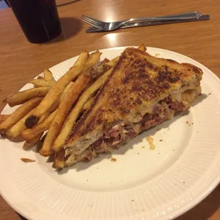 Half of the Rueben and fries