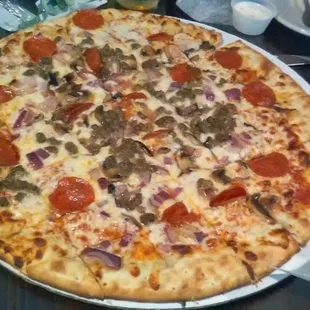 Pizza with mushroom, onion, sausage, and pepperoni.