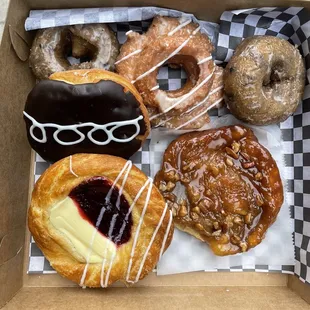 Half Dozen: 2 blueberry cake, one orange old fashioned, guess who, caramel nut danish and strawberry cream cheese danish