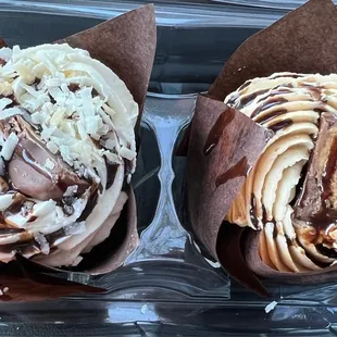 two cupcakes in a plastic container