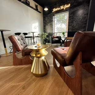 a living room with two chairs and a coffee table