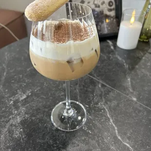 Tiramisu iced coffee with a lady finger