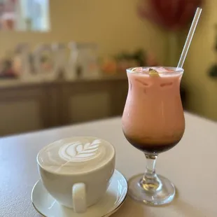 a glass of milkshake and a cup of coffee