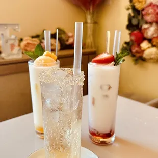 a glass of lemonade and a glass of strawberryade