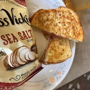 a sandwich and chips on a plate