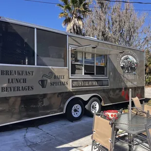 a coffee truck parked on the side of the road
