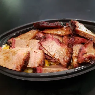 Loaded Baked potato casserole topped with smoked brisket.