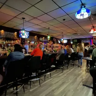 people sitting at a bar