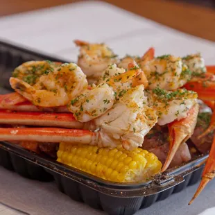 crab legs and corn on the cob