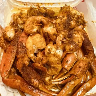 Seafood platter D: Snow crab, jumbo shrimp, corn, sausage, potatoes, and eggs with House Special seasoning