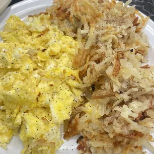 a plate of eggs and hash browns