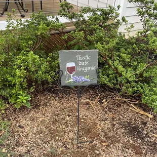 a sign in front of a house