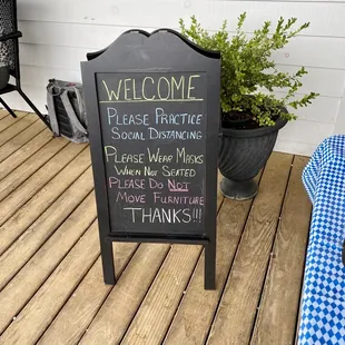 a welcome sign on a porch