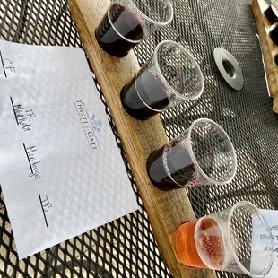 a flight of wine glasses on a table