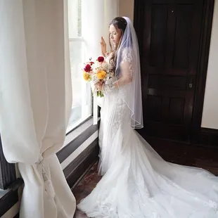 Bride looking out the window at The Thistledome House