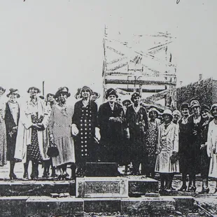 Laying of the cornerstone for Duncan Hall in September,1930.  Sarah Duncan in polka dots.