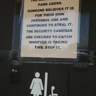 Sign on restroom door.