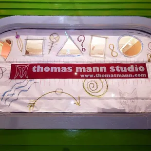 Outside oval window of Thomas Mann Gallery I/O.