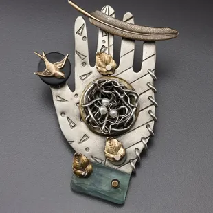 Hand made collage hand pin by Thomas Mann.