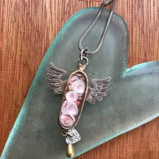 Oval Wing Box Necklace filled with found objects by Thomas Mann. New Orleans, LA.