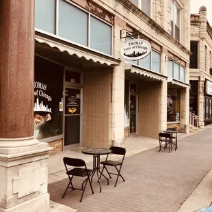  sidewalk with tables and chairs
