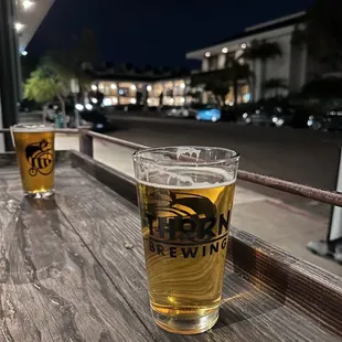 two pints of beer on a table