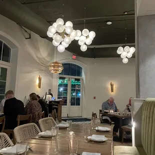 a dining room with people sitting at tables