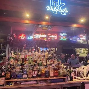 a bar filled with bottles of alcohol