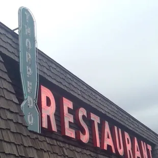 the neon sign for the restaurant