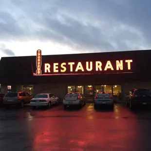 cars parked in front of the restaurant