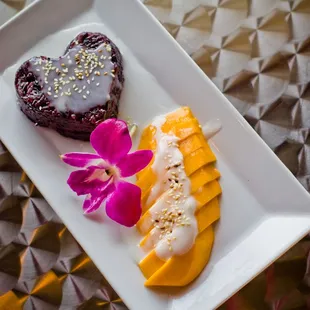 Organic Black Sticky Rice Cooked with coconut milk. Served with Organic Fresh Mango.