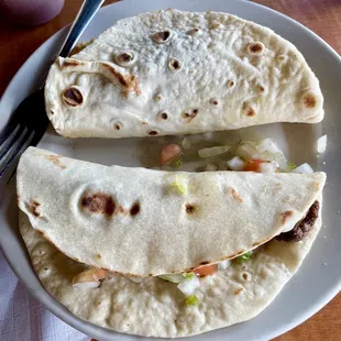 Breakfast tacos.  One was already eaten!  Lots of fresh pico de gallo.