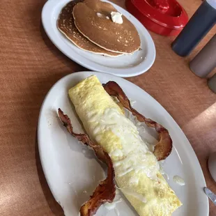 Omelette with chorizo, bacon, and a side of pancakes