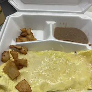 Veggie Omelet, with potatoes and beans...the portion of potatoes and beans were extremely small,  For the price, it should be more!