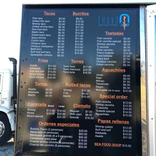 a menu on a food truck