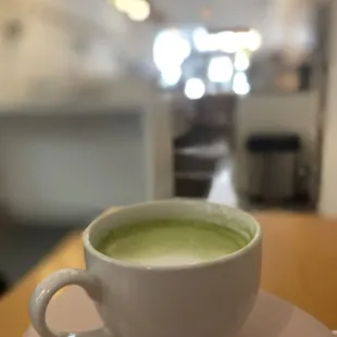 a cup of matcha on a saucer