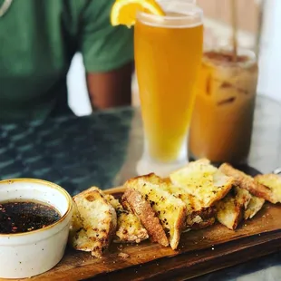 Bread with olive oil herb dip sided with a blue moon beer and pumpkin spice iced latte