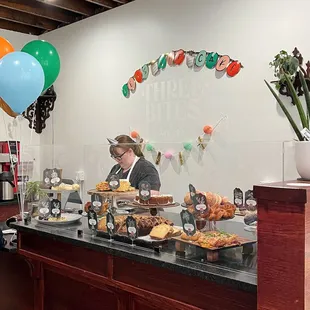 a woman behind the counter