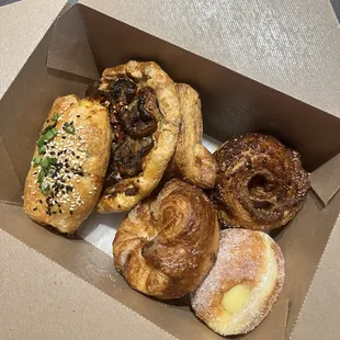 a variety of pastries in a box