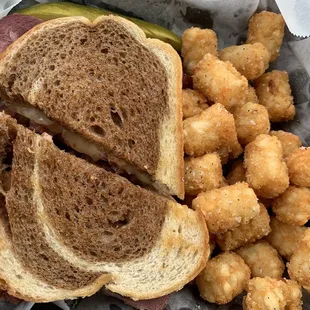 The amazing Ruben with tots still looks amazing in a carry out container. And, still taste amazing.