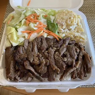 Teriyaki beef sauce on the side potato mac and green salad.