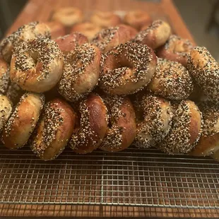a stack of bagels on a cooling rack