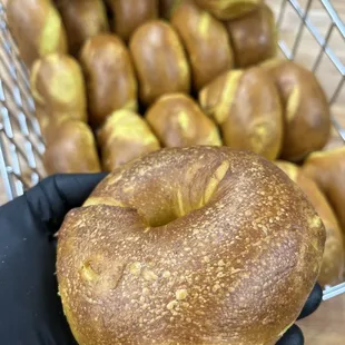 a person holding a bagel