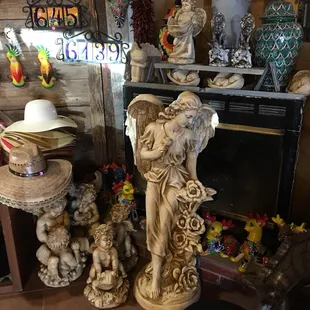 a statue of an angel and a statue of a dog