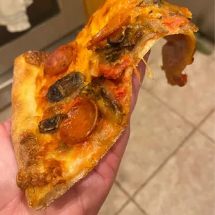 Floppy pepperoni &amp; mushroom slice.  Also don&apos;t know why it&apos;s orange?