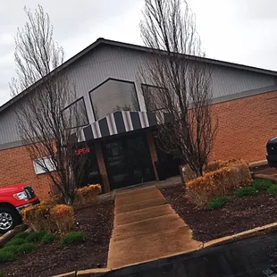 a red truck parked in front of the restaurant
